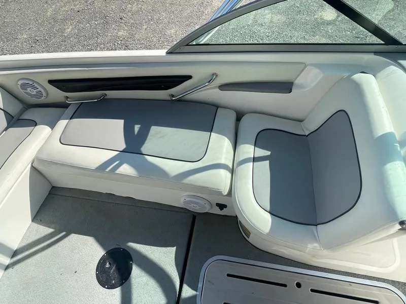 Slide: The Image of 1999 MasterCraft Prostar 205 boat interior with white and gray seating. - 6