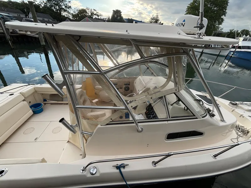 Slide: The Image of 2021 Grady-White Gulfstream 232 boat docked, featuring a spacious cockpit and modern design. - 15