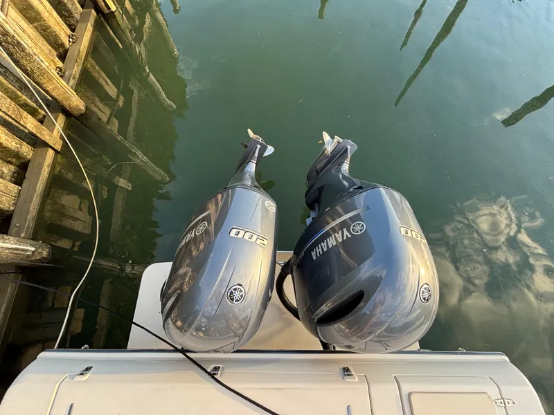 Slide: The Image of Twin Yamaha outboard engines on a 2021 Grady-White Gulfstream 232 boat. - 25