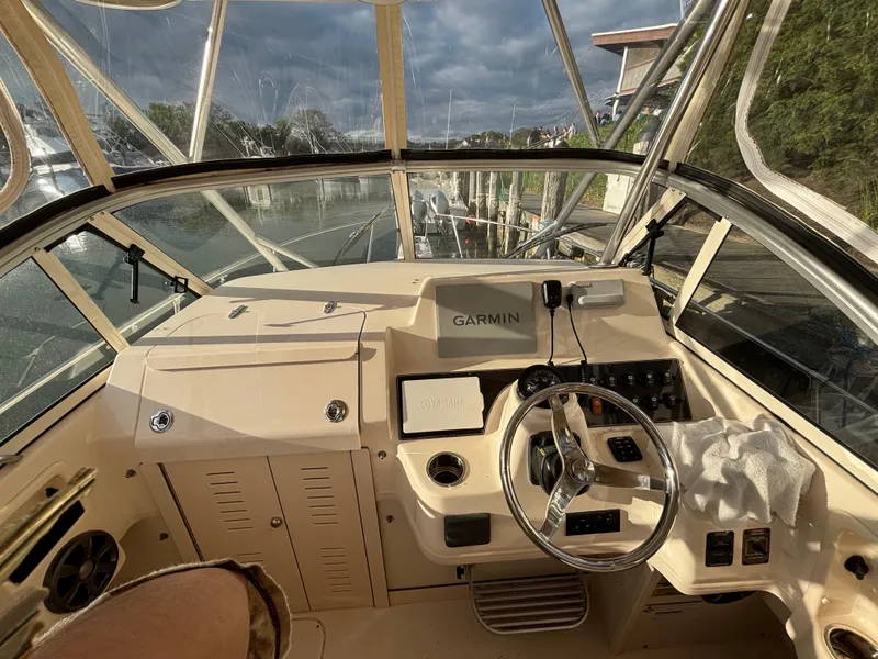 Slide: The Image of 2021 Grady-White Gulfstream 232 boat cockpit with Garmin navigation system. - 37
