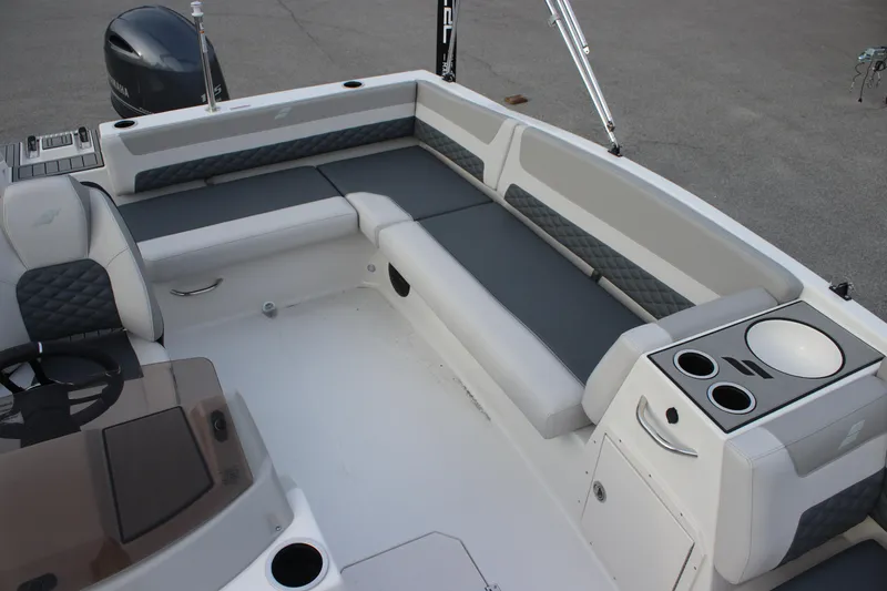 Slide: The Image of 2025 Starcraft SVX 191 OB boat interior with gray seating and cup holders. - 10