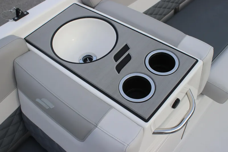 Slide: The Image of 2025 Starcraft SVX 191 OB boat interior with sink and cup holders. - 11