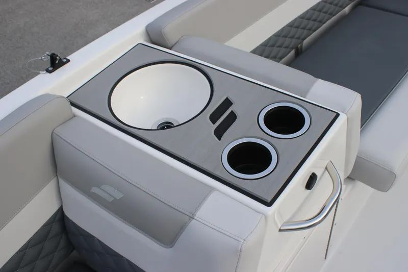 Slide: The Image of 2025 Starcraft SVX 191 OB boat interior with sink and cup holders. - 12