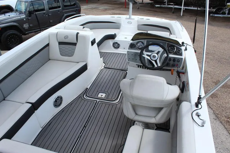 Slide: The Image of 2022 Hurricane SunDeck Sport 192 RL OB boat interior with seating and steering console. - 4