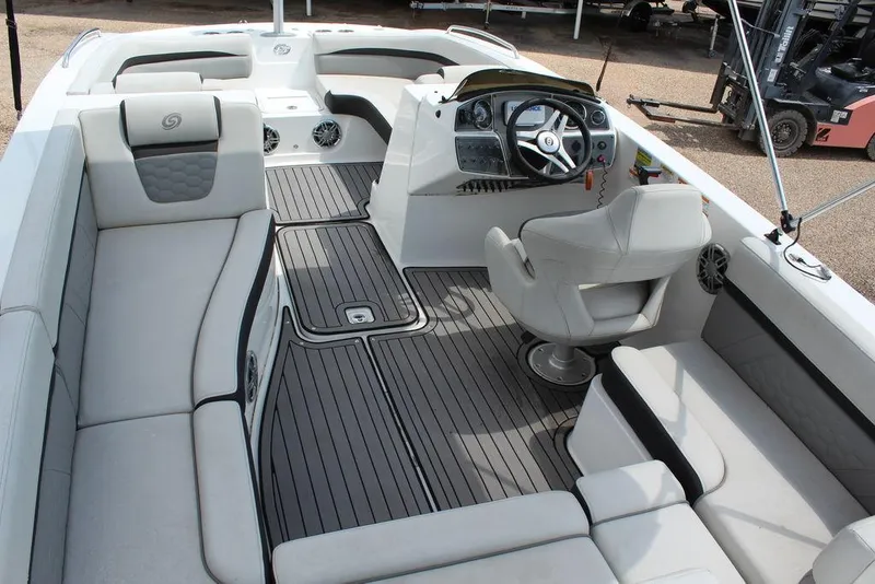 Slide: The Image of 2022 Hurricane SunDeck Sport 192 RL OB boat interior with spacious seating and modern helm. - 7