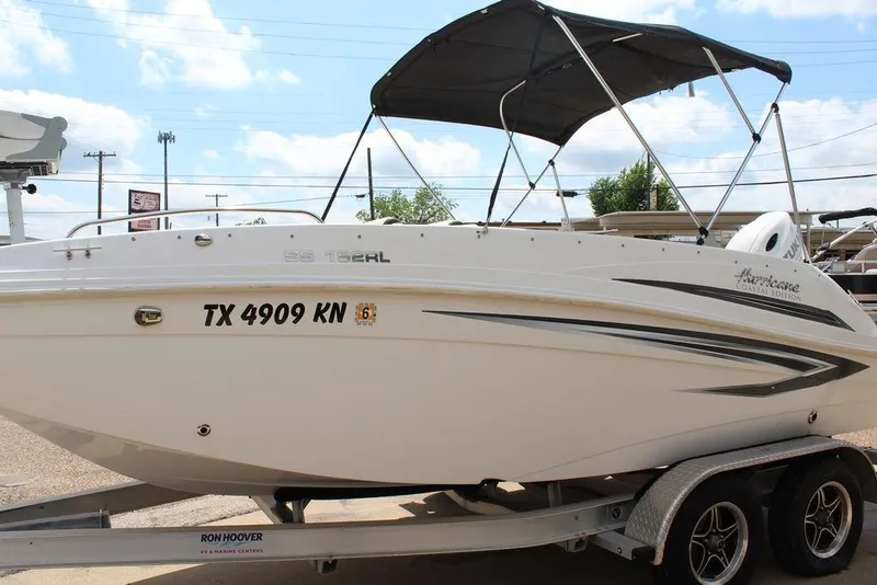 Slide: The Image of 2022 Hurricane SunDeck Sport 192 RL OB boat on trailer, side view with canopy. - 8