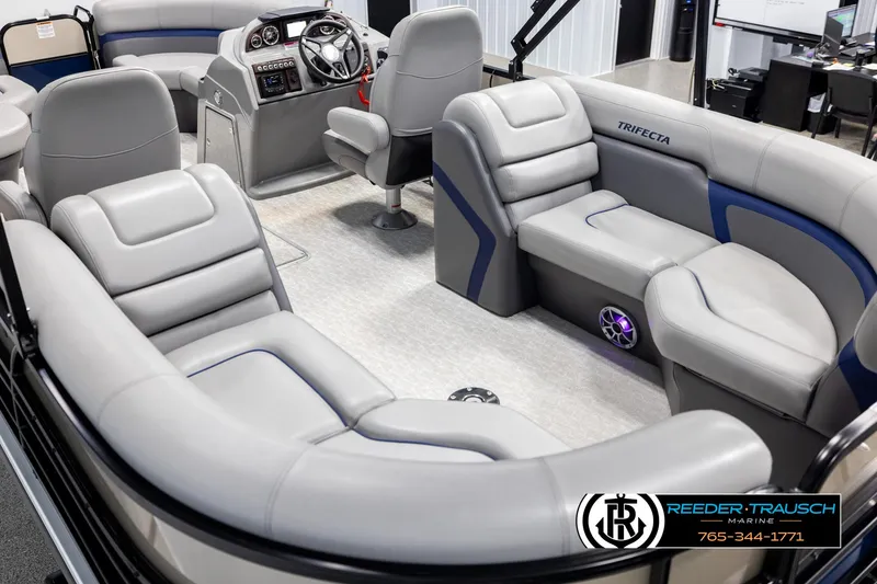 Slide: The Image of 2021 Trifecta 22 CS pontoon boat interior with luxurious seating and modern dashboard. - 10