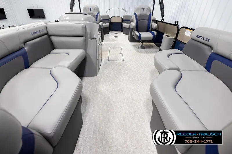 Slide: The Image of 2021 Trifecta 22 CS pontoon boat interior with plush seating and modern design. - 12