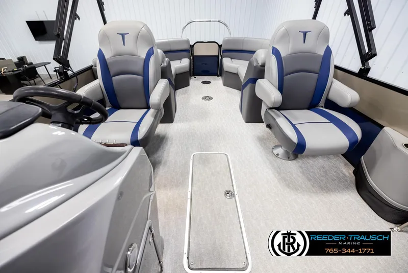 Slide: The Image of Interior of a 2021 Trifecta 22 CS boat with gray and blue seating. - 13