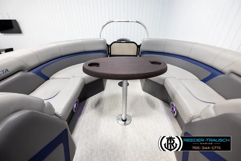Slide: The Image of Interior of 2021 Trifecta 22 CS pontoon boat with circular seating and table. - 16