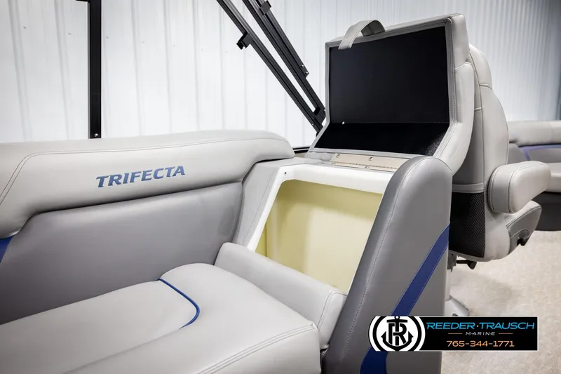 Slide: The Image of 2021 Trifecta 22 CS boat interior with storage compartment and seating. - 22