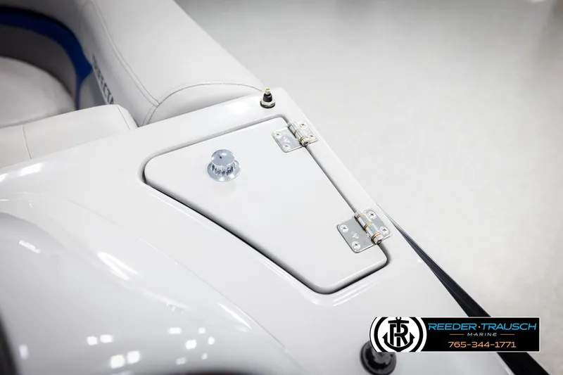 Slide: The Image of 2021 Trifecta 22 CS boat detail with white seating and storage compartment. - 23
