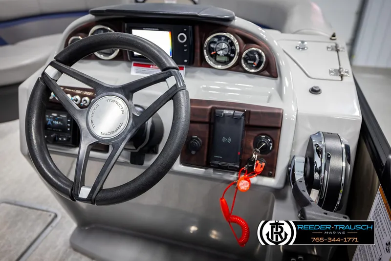 Slide: The Image of Steering console of a 2021 Trifecta 22 CS boat with gauges and controls. - 25