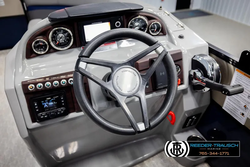 Slide: The Image of Steering console of 2021 Trifecta 22 CS boat with gauges and controls. - 26