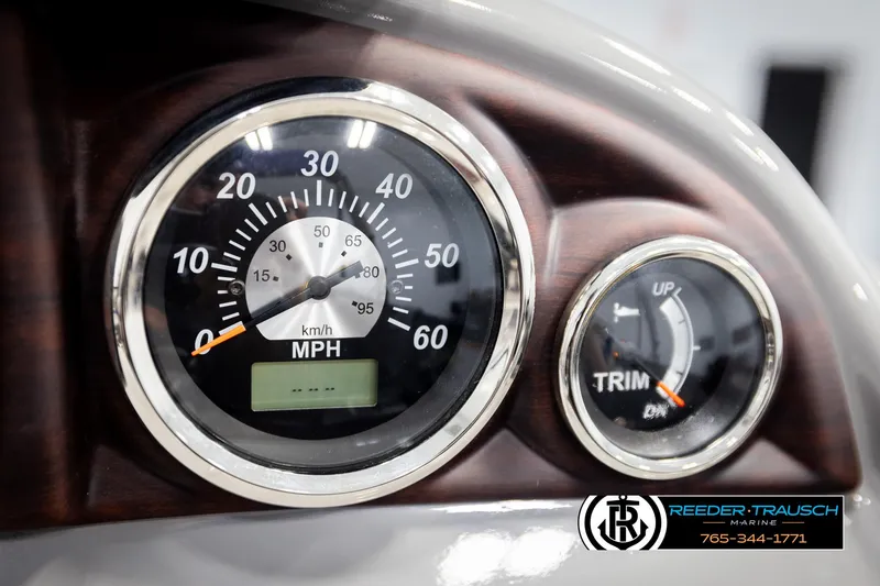 Slide: The Image of Dashboard of 2021 Trifecta 22 CS with speedometer and trim gauge. - 31