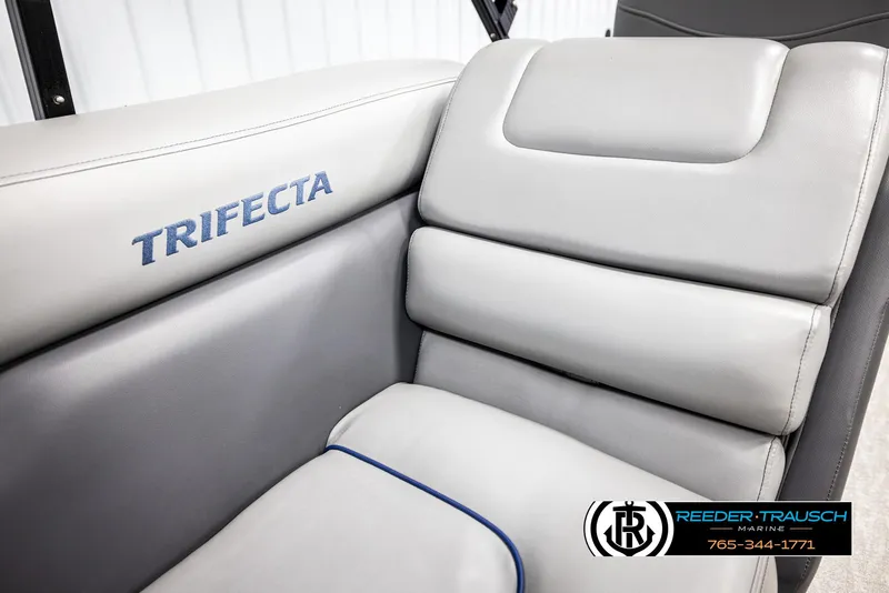 Slide: The Image of 2021 Trifecta 22 CS boat seat with logo, featuring gray upholstery and blue stitching. - 37