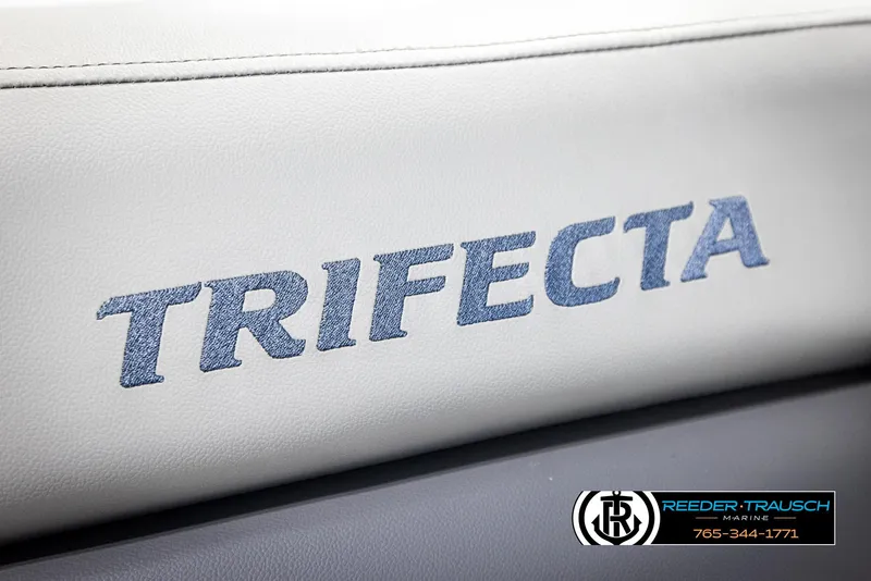 Slide: The Image of Trifecta 22 CS 2021 logo on white leather with Reeder-Trausch Marine branding. - 38