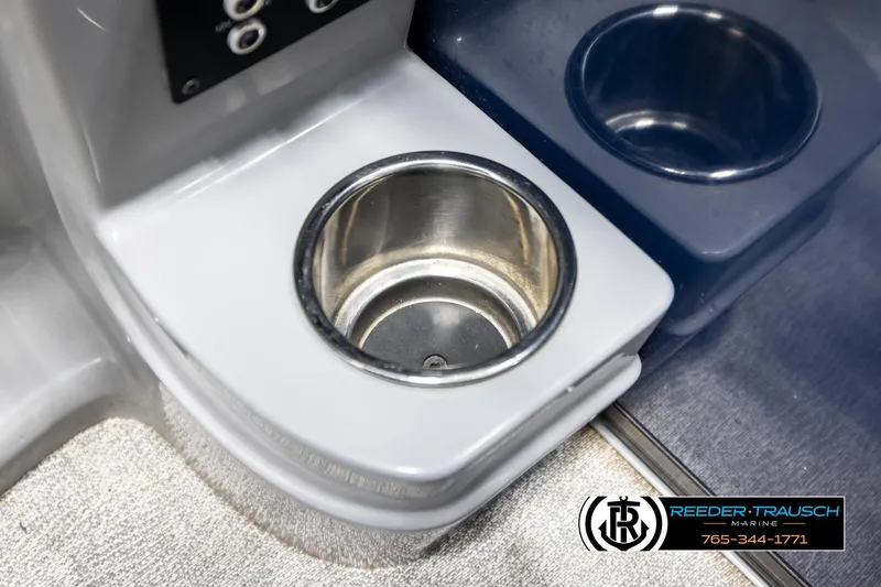 Slide: The Image of Cup holder on a 2021 Trifecta 22 CS boat, featuring Reeder-Trausch Marine branding. - 39