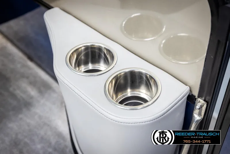 Slide: The Image of Cup holders in a 2021 Trifecta 22 CS boat, featuring sleek stainless steel design. - 41