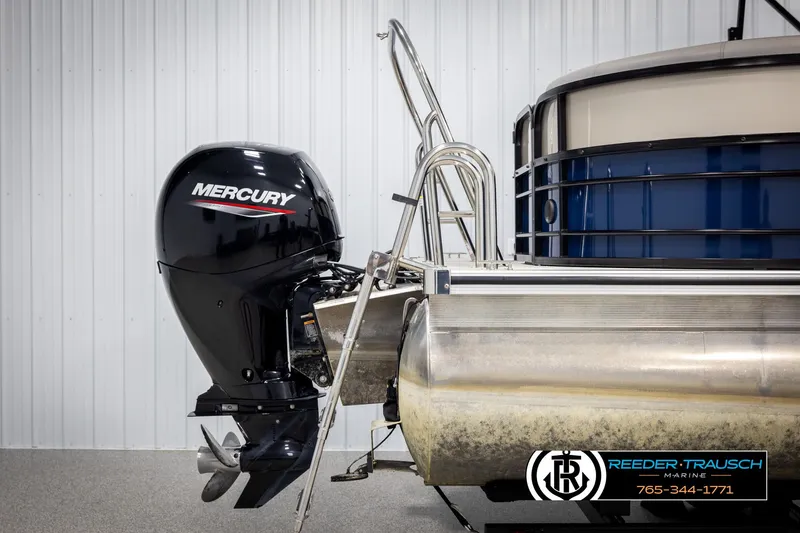 Slide: The Image of 2021 Trifecta 22 CS pontoon boat with Mercury outboard motor in a showroom. - 42