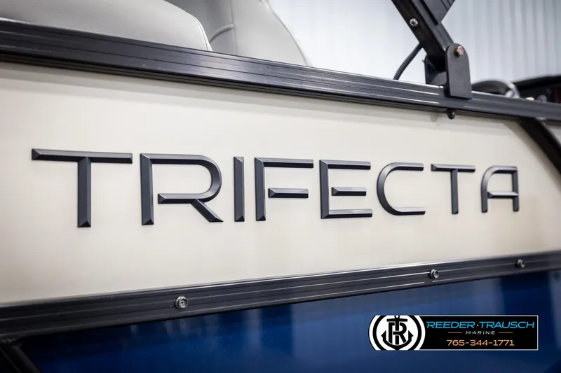 Slide: The Image of 2021 Trifecta 22 CS boat side view with logo and dealership contact. - 47