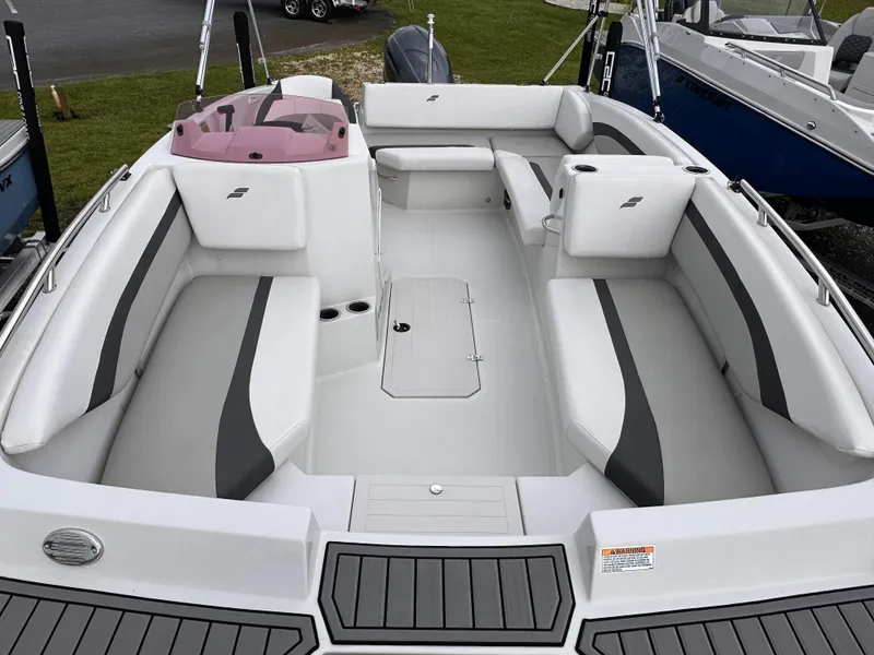 Slide: The Image of 2024 Starcraft 171 SVX boat interior with white and gray seating, spacious layout. - 12