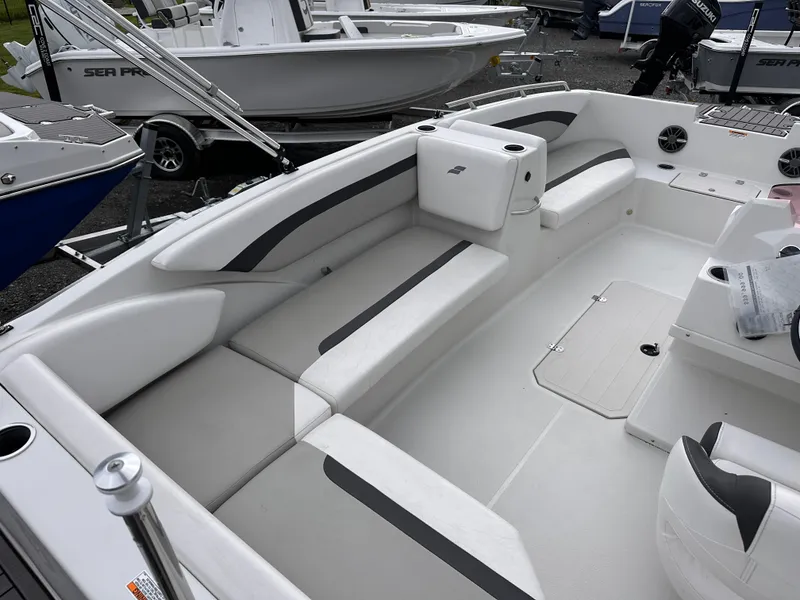 Slide: The Image of 2024 Starcraft 171 SVX boat interior with white seating and modern design. - 15