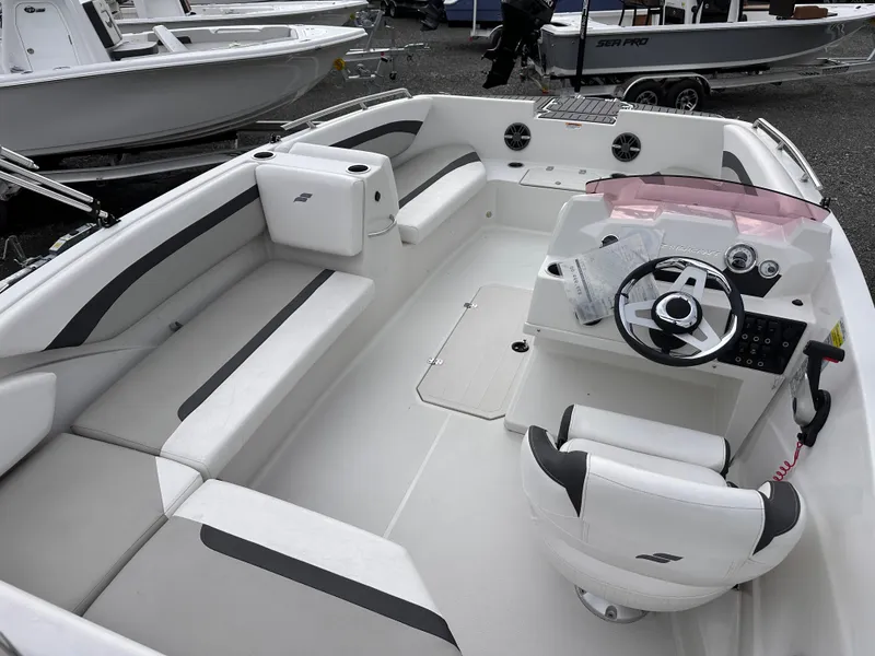 Slide: The Image of 2024 Starcraft 171 SVX boat interior with seating and steering console, showcasing modern design. - 6