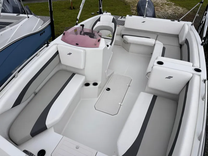 Slide: The Image of 2024 Starcraft 171 SVX boat interior with white and gray seating, modern design, and spacious layout. - 7