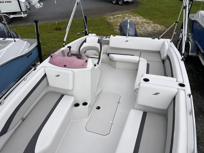 Slide: The Image of 2024 Starcraft 171 SVX boat interior with seating and steering console. - 9