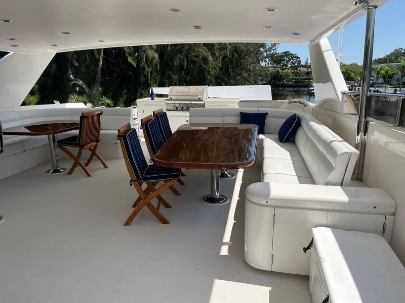 Slide: The Image of Luxurious 2002 Hargrave Raised Pilothouse yacht deck with elegant seating and dining area. - 10