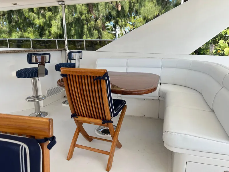 Slide: The Image of Luxurious 2002 Hargrave Raised Pilothouse yacht deck with seating and table. - 11