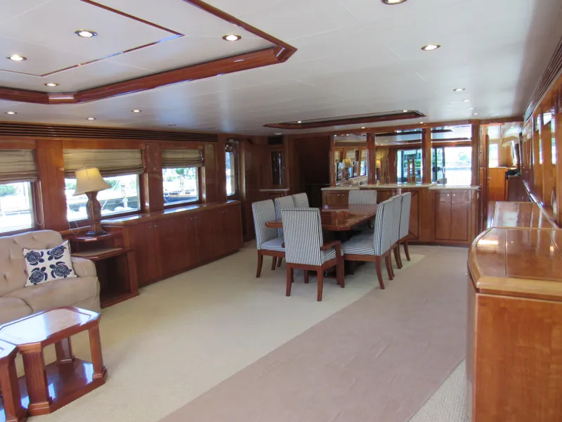Slide: The Image of Luxurious interior of 2002 Hargrave Raised Pilothouse yacht with elegant dining area and wood finishes. - 19