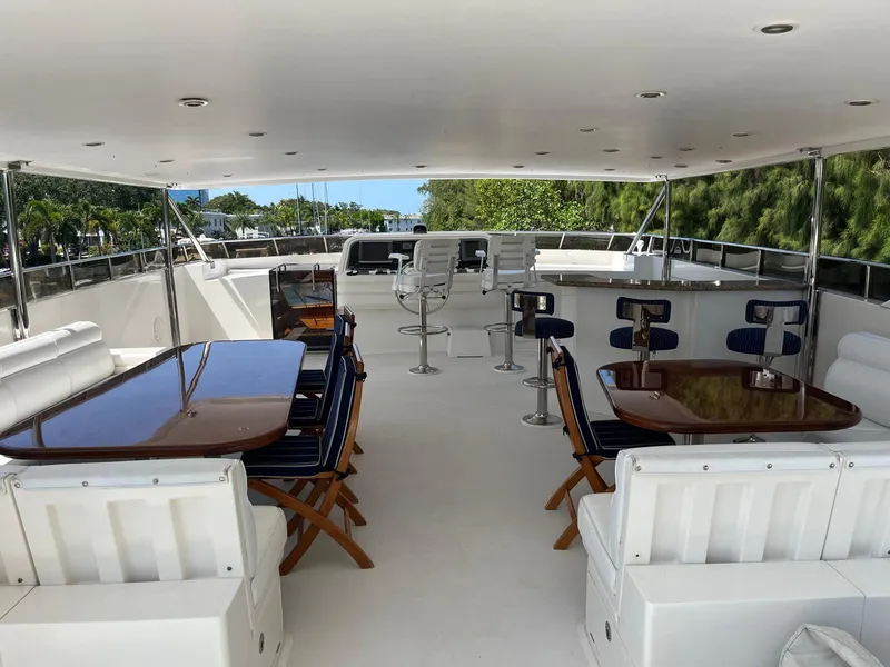 Slide: The Image of Luxurious 2002 Hargrave Raised Pilothouse yacht deck with seating and tables. - 2