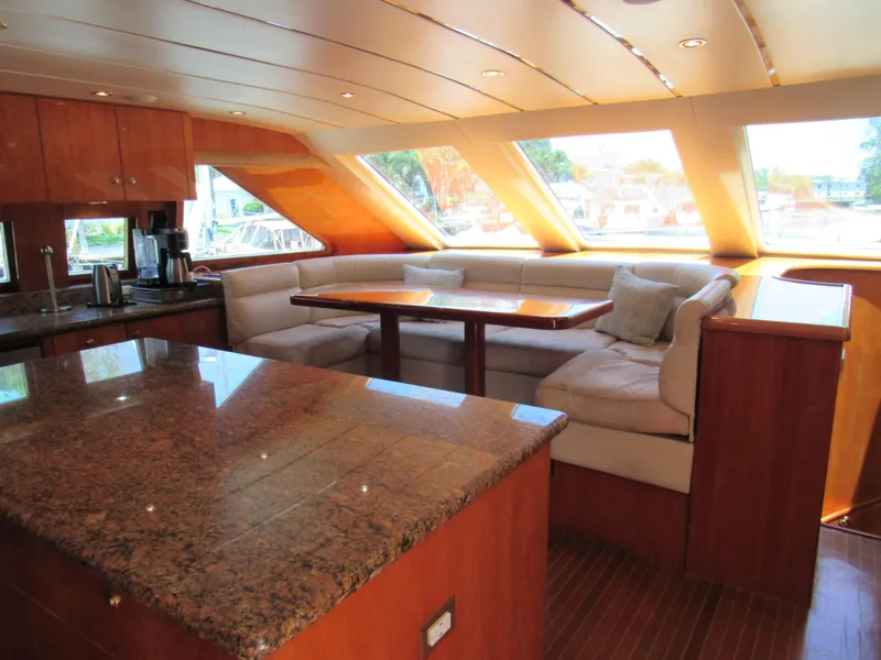 Slide: The Image of Luxurious 2002 Hargrave Raised Pilothouse interior with wood finish and modern navigation equipment. - 25