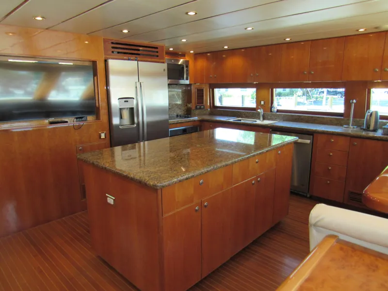 Slide: The Image of Luxurious interior of 2002 Hargrave Raised Pilothouse yacht with plush seating and wooden accents. - 27