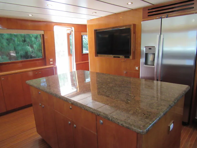 Slide: The Image of 2002 Hargrave Raised Pilothouse interior with wooden finish and navigation equipment. - 28