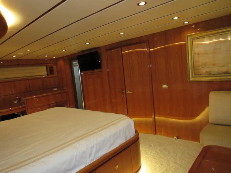 Slide: The Image of Luxurious interior of 2002 Hargrave Raised Pilothouse yacht with polished wood finishes. - 34