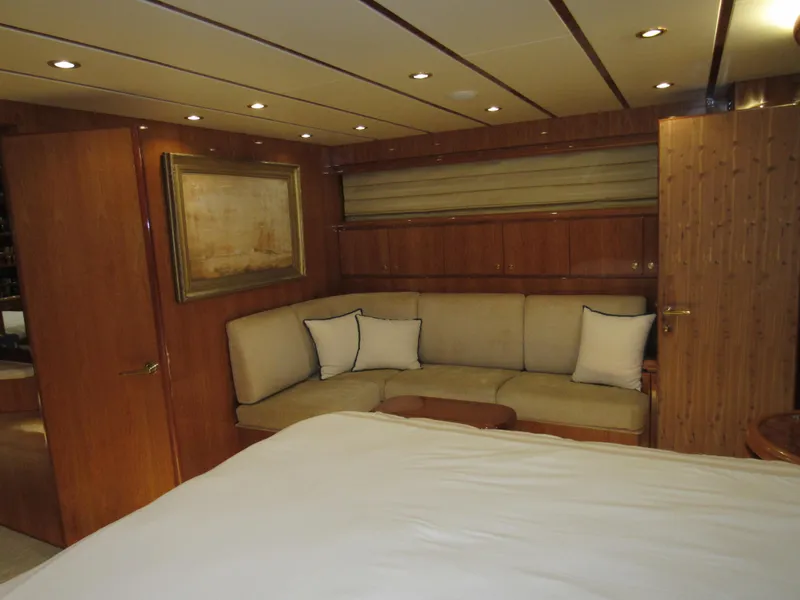 Slide: The Image of Luxurious bedroom interior of 2002 Hargrave Raised Pilothouse yacht with elegant wood finishes. - 35