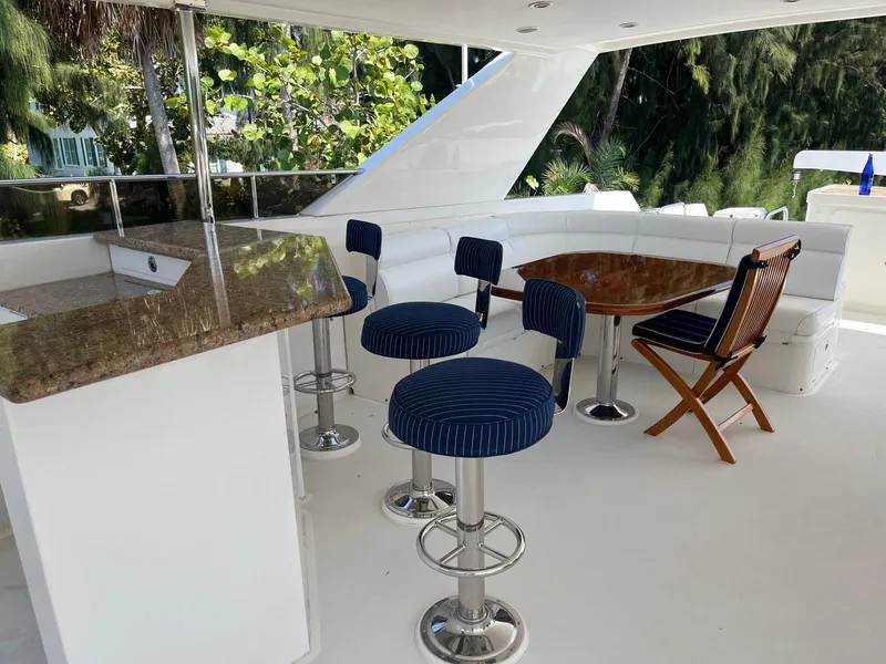 Slide: The Image of Luxurious 2002 Hargrave Raised Pilothouse yacht deck with seating and bar area. - 5