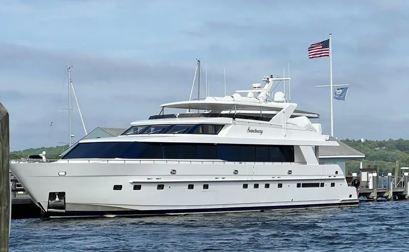Slide: The Image of Luxury 2002 Hargrave Raised Pilothouse yacht docked by the water. - 63