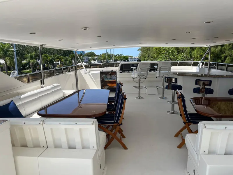 Slide: The Image of Luxurious 2002 Hargrave Raised Pilothouse yacht deck with seating and tables. - 7
