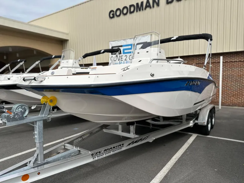 Slide: The Image of 2024 Starcraft SVX 211 OB CC boat on trailer, displayed outdoors. - 4