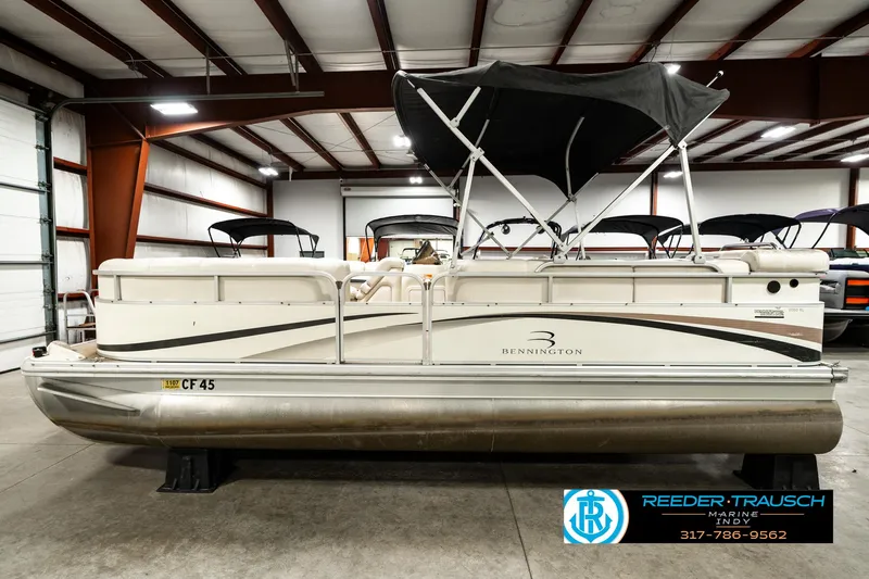 Slide: The Image of 2003 Bennington 2050 RL pontoon boat in indoor storage facility. - 11