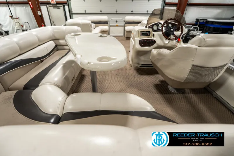 Slide: The Image of 2003 Bennington 2050 RL pontoon boat interior with seating and helm. - 19