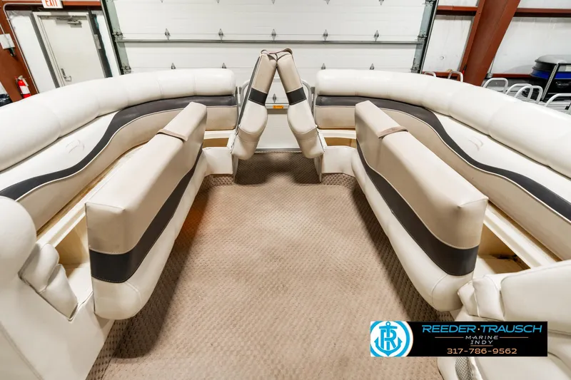 Slide: The Image of Interior of 2003 Bennington 2050 RL pontoon boat with beige seating and carpet. - 23