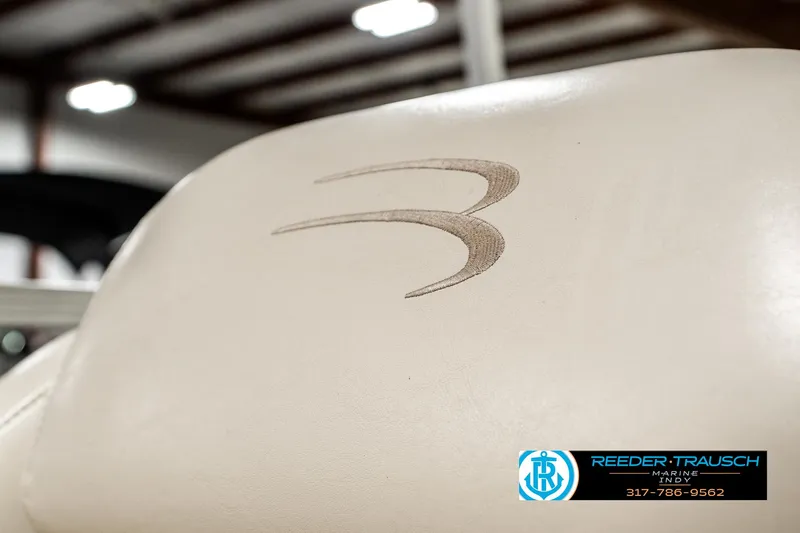 Slide: The Image of Close-up of Bennington 2050 RL 2003 boat seat with logo in showroom. - 37