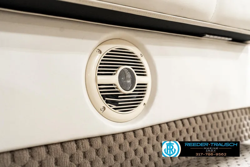 Slide: The Image of Speaker on a 2003 Bennington 2050 RL boat interior, featuring textured upholstery. - 39