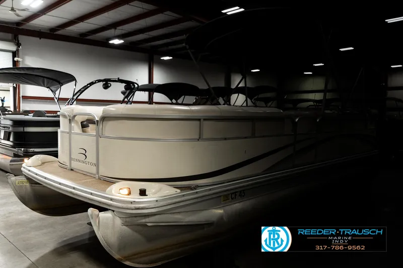 Slide: The Image of 2003 Bennington 2050 RL pontoon boat in indoor storage facility. - 4