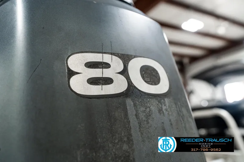 Slide: The Image of Close-up of a Bennington 2050 RL boat engine with "80" marking, 2003 model. - 43